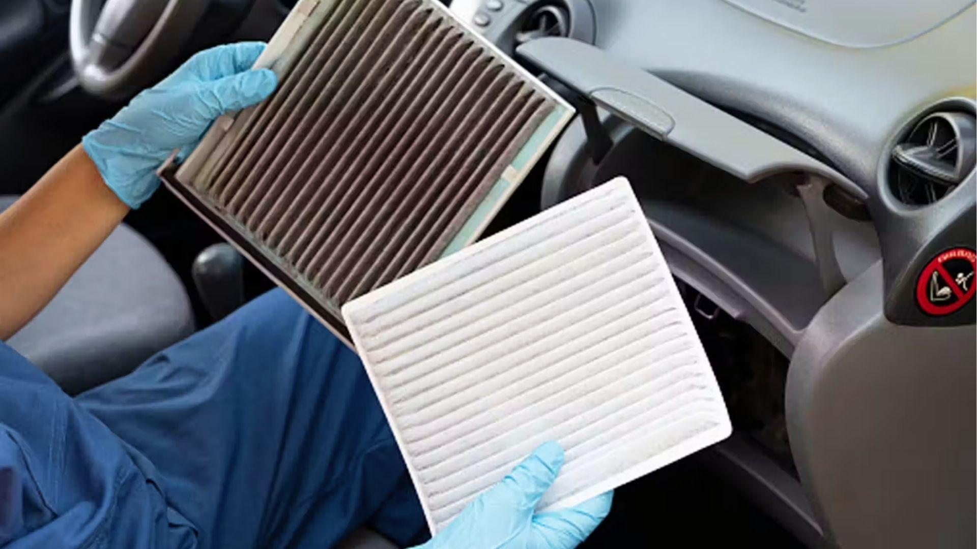 Mechanic comparing dirty and clean cabin air filters to remove trapped weed smell